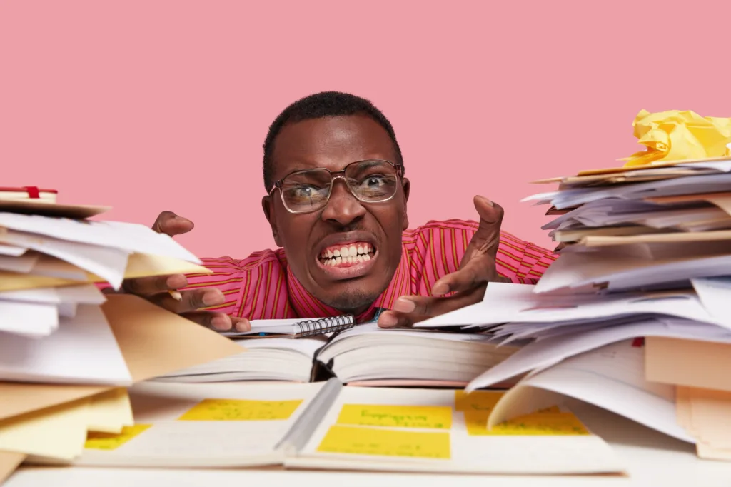 An accountant performing ledger reconciliation for his company's legacy ledger balances.